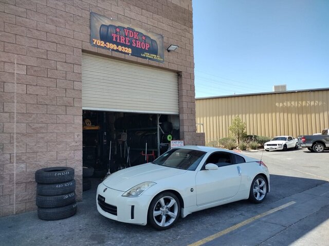 White Nissan 350Z At Tire Shop 041 — VDK Tire Shop