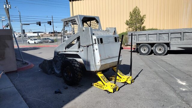 Skid Steer Lifted With Floor Jacks 001 — VDK Tire Shop