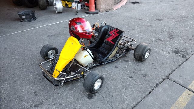 Yellow Go Kart Red Helmet 001 — VDK Tire Shop