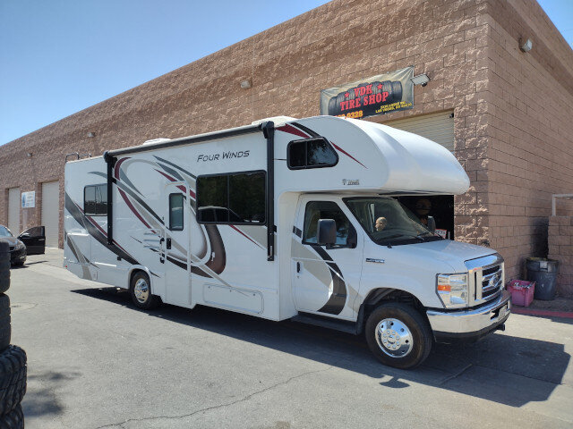 White Four Winds RV Parked 025 — VDK Tire Shop