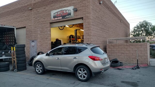 Silver SUV Parked Outside Tire Shop 015 — VDK Tire Shop
