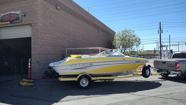 Yellow Tahoe Boat On Trailer 007 — VDK Tire Shop