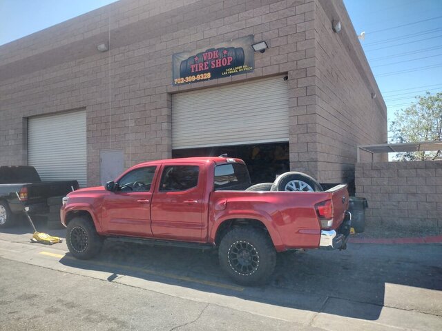 Red Pickup Truck Outside Tire Shop 078 — VDK Tire Shop