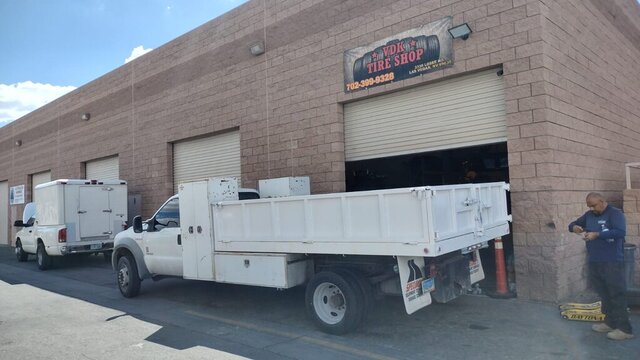 White Utility Truck Outside Tire Shop 015 — VDK Tire Shop