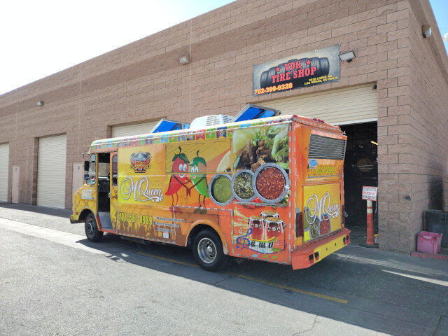 Colorful Food Truck Parked Outside Tire Shop 017 — VDK Tire Shop